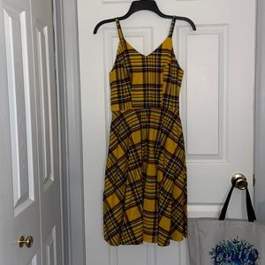 Yellow plaid like dress with pockets. Never been worn
